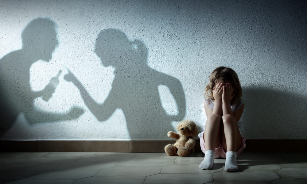 Little Girl Crying With Shadow Of Parents Arguing - Home Violenc