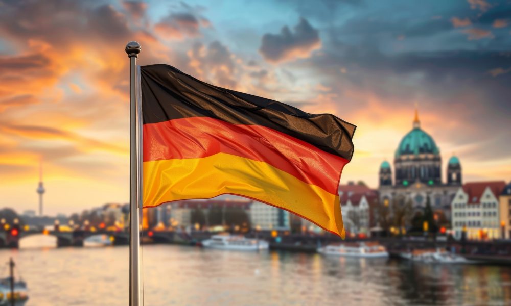 German flag waving with city skyline as background, symbolic representation of germany