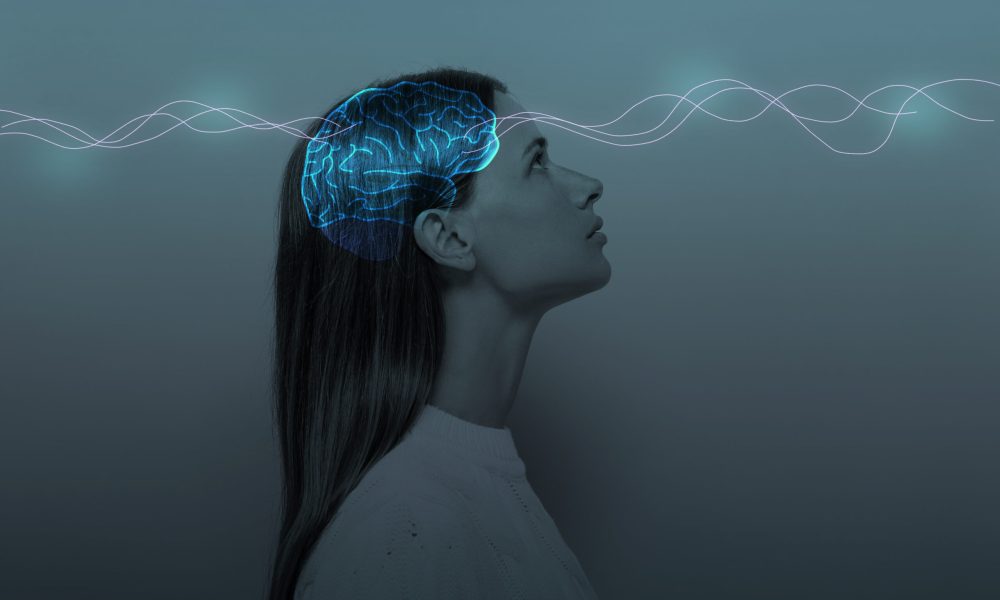 Young girl with closed eyes and neon glowing brain. Women's Mental Health and Meditation